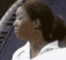 a blurry picture of a man 's face with the number 5 in the corner