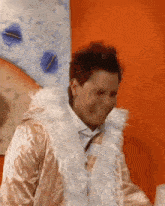 a man is wearing a fur coat and a white shirt