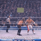 two wrestlers in a wrestling ring with the words standing shooting star press above them