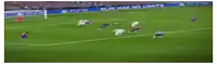 a blurry picture of a soccer player wearing a white jersey with red , blue and white stripes .
