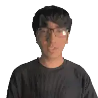 a man wearing glasses and a black tommy shirt