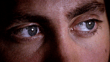 a close up of a man 's eyes with a few tears in them