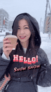 a woman in a black jacket holding a cup of coffee with the words hello snow snow above her