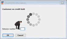 a computer screen shows a man talking on a cell phone and the words customer on credit hold below him
