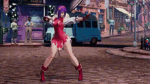 a woman in a red dress is standing on a cobblestone street holding a sword .
