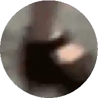 a blurry picture of a person 's face in a circle .