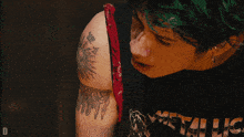 a close up of a person 's face with the letter d visible