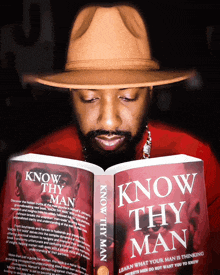 a man is reading a book titled know thy man
