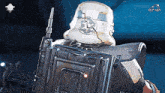 a storm trooper holding a gun and a shield with the letters a7a on the bottom
