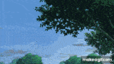 a tree with leaves against a blue sky with make a gif.com written below it