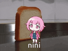 a girl with pink hair is standing next to a loaf of bread with the word nini on it