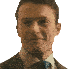 a man in a suit and tie looks at the camera