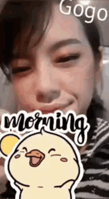 a woman with a sticker on her face that says morning and gogo