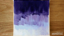 a purple and blue painting with the words made in animotica below it