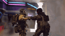 two soldiers are shaking hands in front of a sign that says once upon