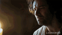 a close up of a man 's face with the word leonardo on the bottom right