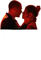 a man and a woman are kissing in a dark room