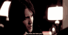 a man is asking why does she hate you in a dark room .