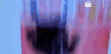 a close up of a glass of red and blue liquid on a blue background .