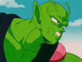 a close up of a green cartoon character with an angry face