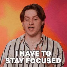 a man says " i have to stay focused " in a striped shirt