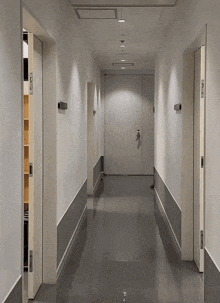 a long hallway with a door that says ' a ' on the wall