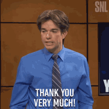 a man wearing a blue shirt and tie says thank you very much