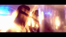 a blurry picture of a man and woman with judleklek7u2 written on the bottom right