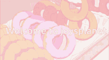 a pink background with the words welcome to joysplanet at the top