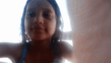 a young girl taking a selfie with a white background