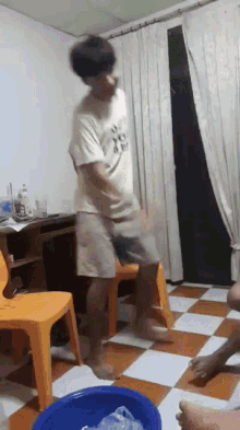 a man wearing a shirt that says ' i love you ' on it is jumping in the air