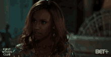 a woman in a gold dress is featured in a first wives club advertisement