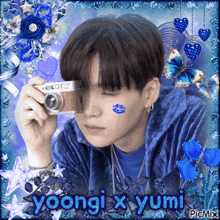 a boy with a kiss on his face is taking a picture with a camera and the words yoongi x yumi written below him