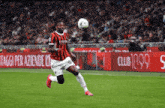 a soccer player kicks a ball in front of a club 1899 advertisement