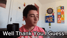 a young man says well thank you i guess in front of a dart board