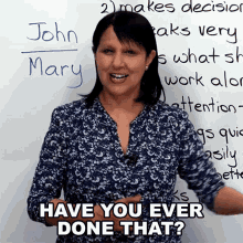 a woman stands in front of a white board with the words have you ever done that