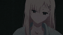 a girl with blonde hair and blue eyes is looking down