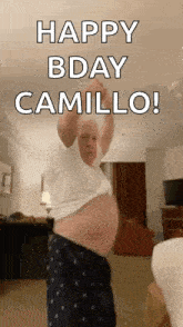 an older man is dancing in a living room and says happy bday camillo