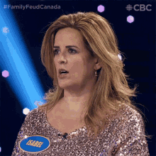 a woman in a sequined top has a name tag that says isabel on it