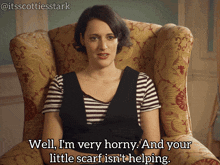 a woman sits in a chair and says well i 'm very horny