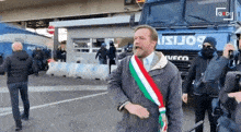 a man stands in front of a truck that says iveco on it