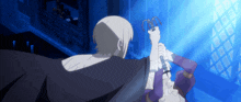 a man in a black cape is holding a woman 's arm in a dark room