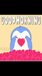 a penguin with a heart in its mouth and the words good morning
