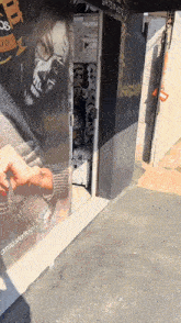 a store front with a picture of a woman with a skull face