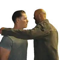 a man in a gray shirt is hugging another man in a black jacket