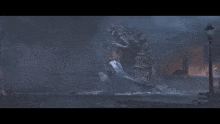 a giant monster is attacking a smaller monster in a dark city