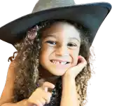 a little girl with curly hair wearing a black cowboy hat