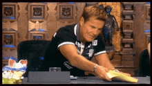 a man in a black shirt with the number 10 on the front