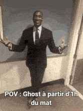 a man in a suit and tie is standing in a hallway with his arms outstretched and the caption pov ghost
