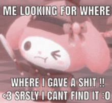 a pink hello kitty is holding a knife and looking for where i gave a shit